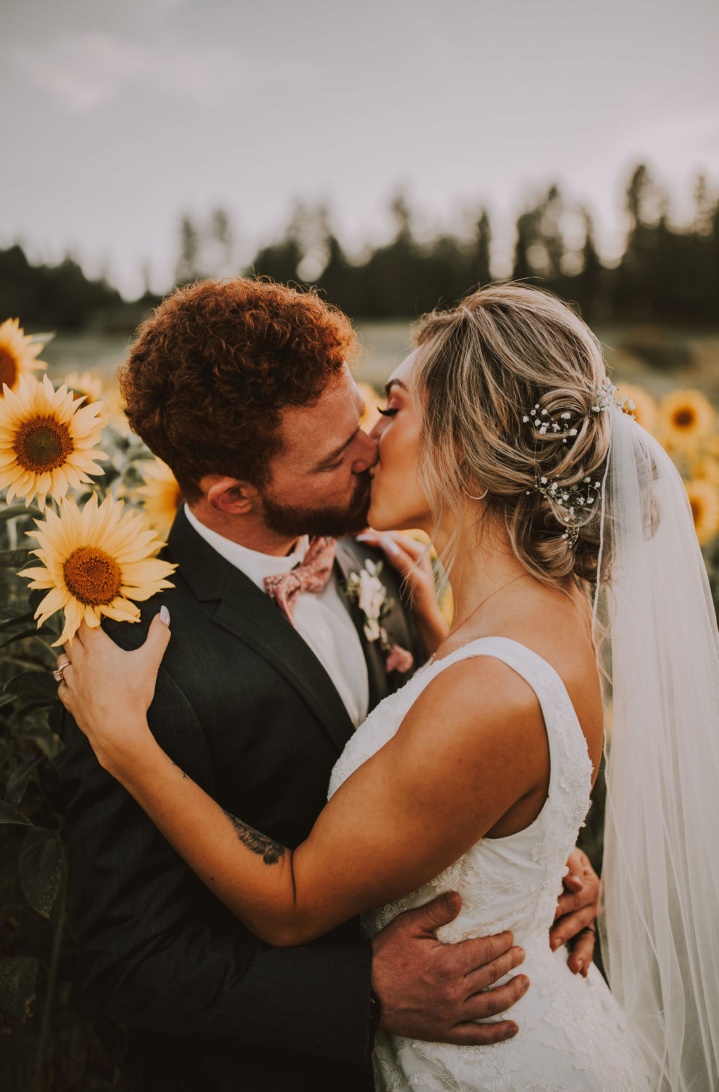 Spokane Washington Wedding Photos with a Kiss in a Sunflower field