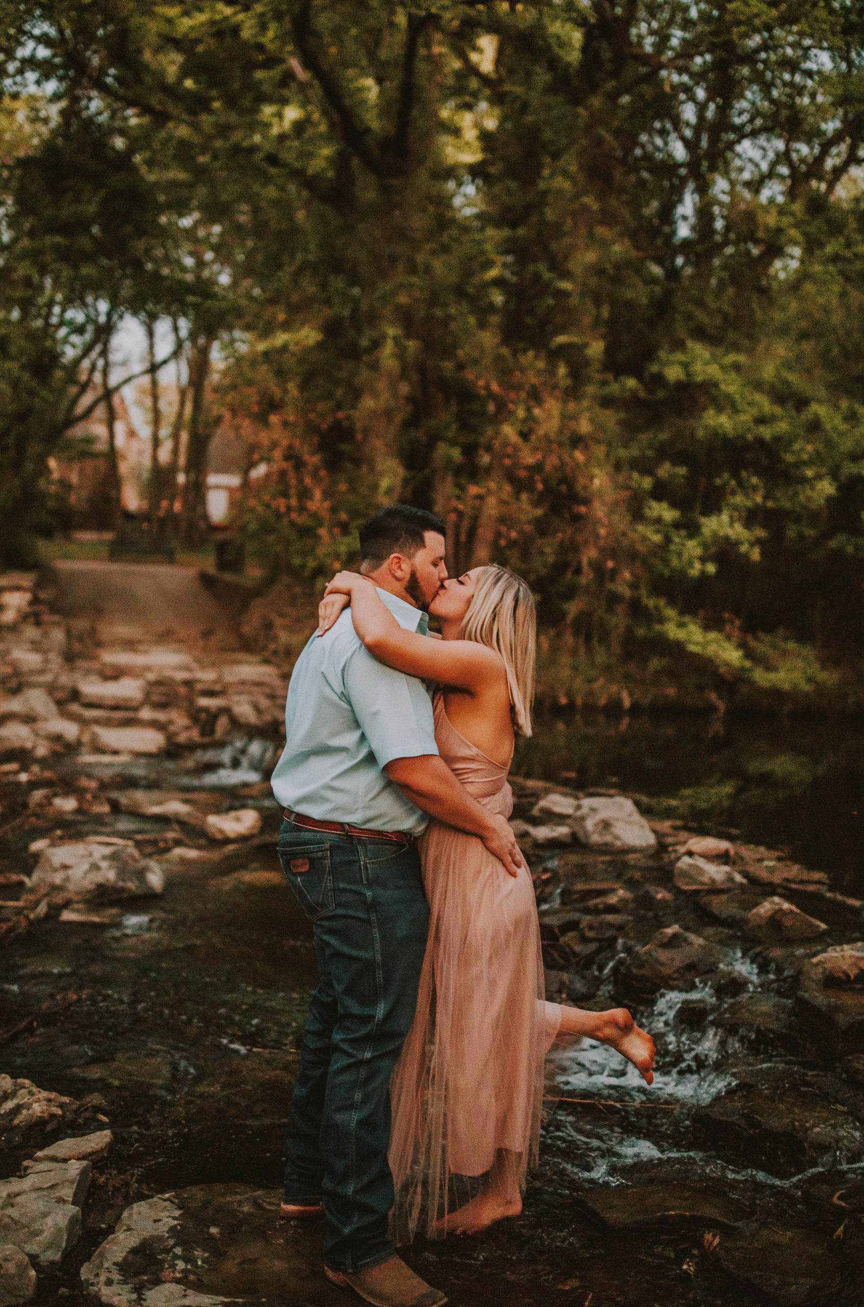 Prairie Creek Park Engagement kiss with bride and groom